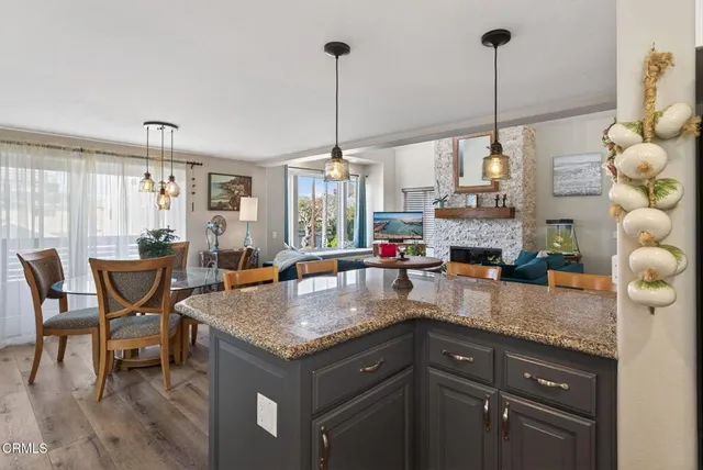 a kitchen with stainless steel appliances granite countertop a stove and a sink