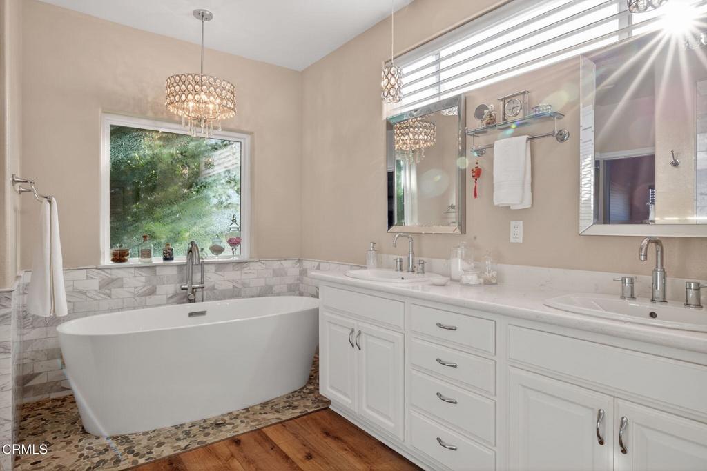 116 Pasadena Avenue Oxnard, CA 93035 - Photo 29 of 52 a bathroom with a sink and a large mirror