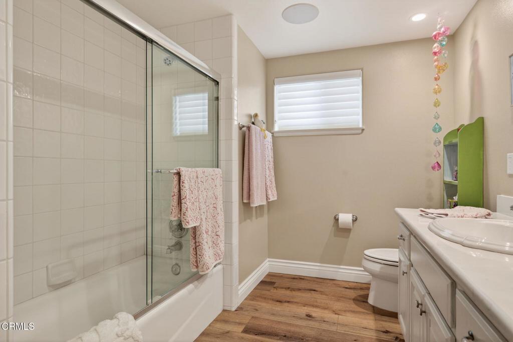 116 Pasadena Avenue Oxnard, CA 93035 - Photo 34 of 52 a bathroom with a granite countertop sink a toilet and shower