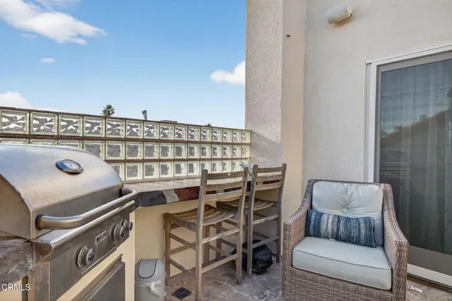 a view of roof deck with furniture