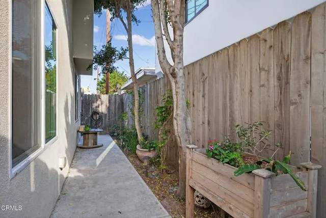 an aerial view of houses with outdoor space