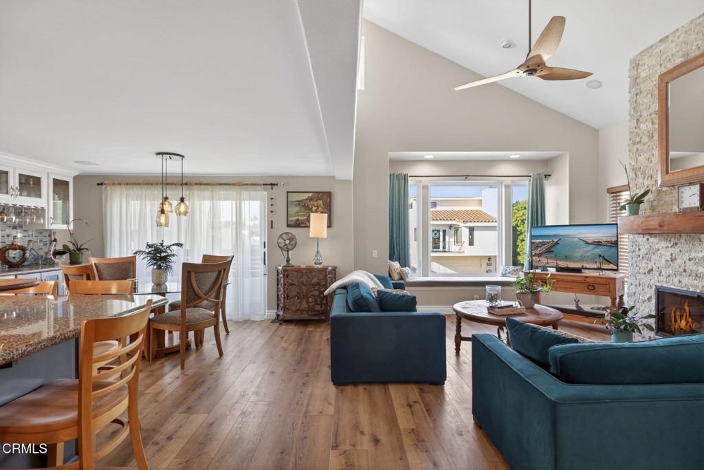 116 Pasadena Avenue Oxnard, CA 93035 - Photo 9 of 52 a living room with fireplace furniture and a wooden floor