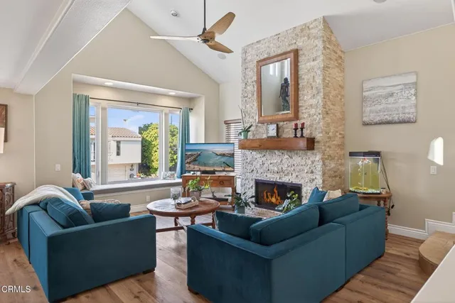 a living room with furniture and a fireplace