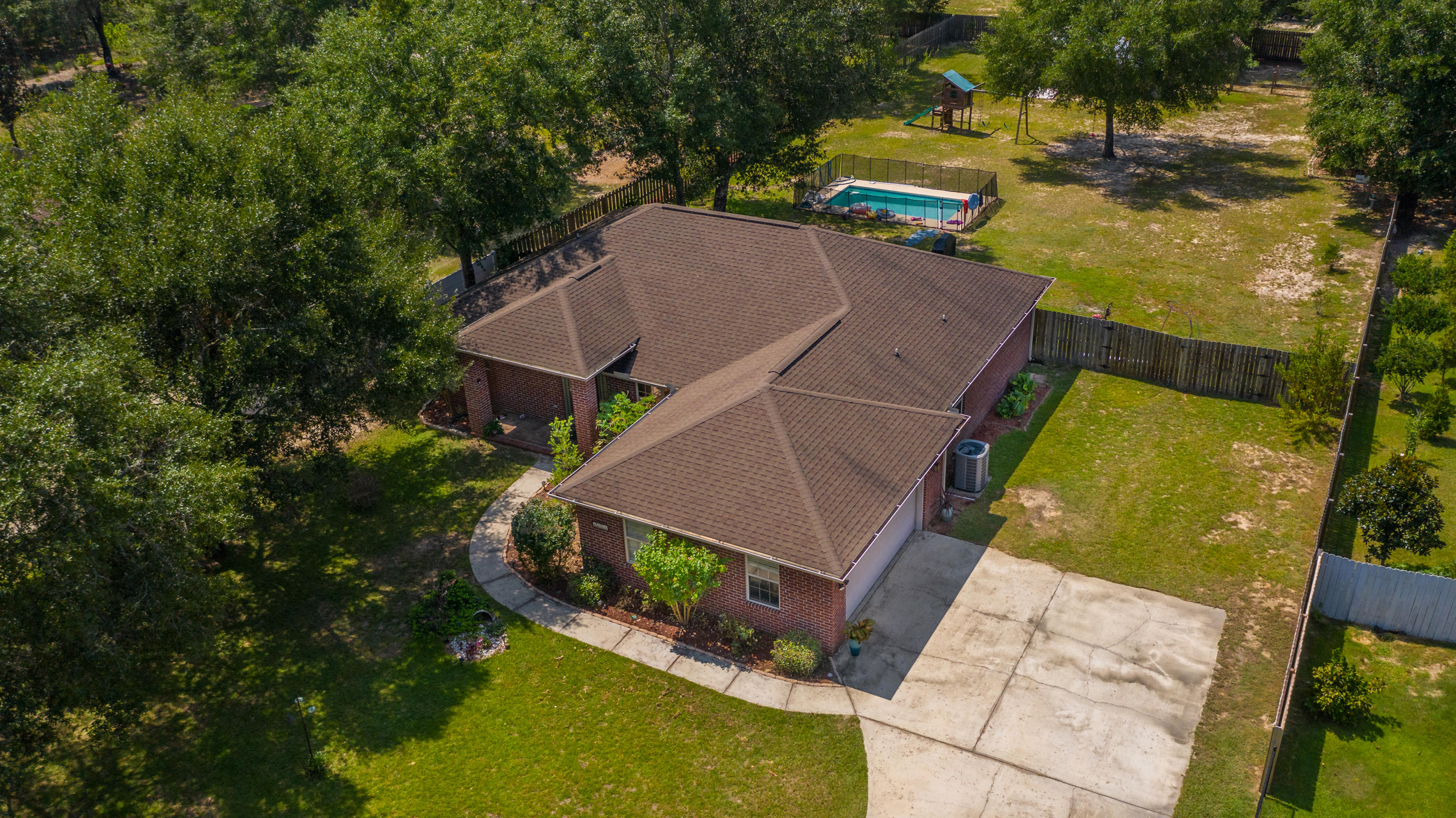 4214 Painter Branch Road Crestview, FL 32539 - Photo 2 of 41 an aerial view of a house with a yard basket ball court and outdoor seating