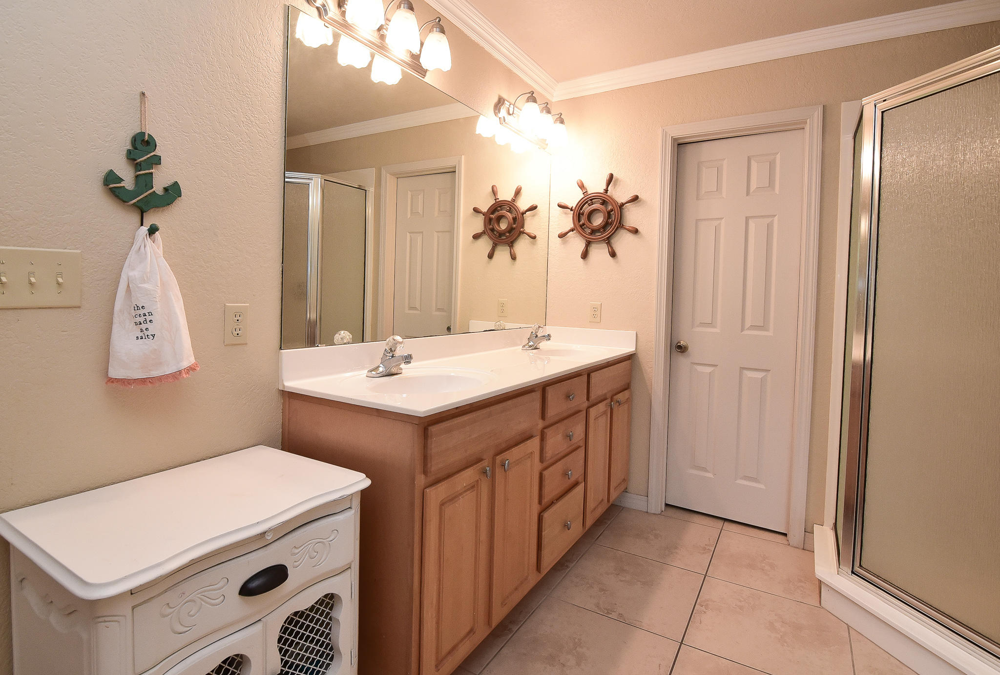 4214 Painter Branch Road Crestview, FL 32539 - Photo 11 of 41 a bathroom with a double vanity sink and a mirror