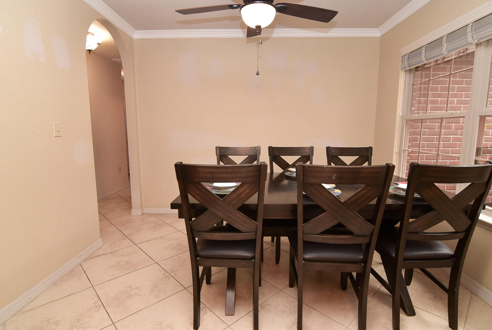 4214 Painter Branch Road Crestview, FL 32539 - Photo 12 of 41 a view of a dining room with furniture and chandelier