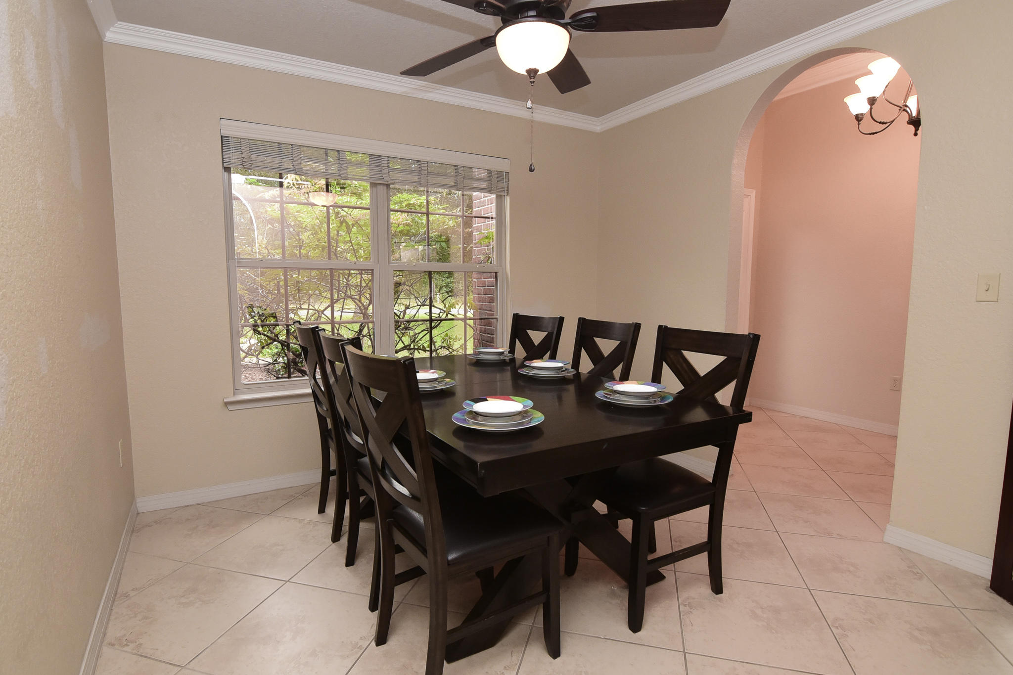 4214 Painter Branch Road Crestview, FL 32539 - Photo 13 of 41 a view of a dining room with furniture and chandelier