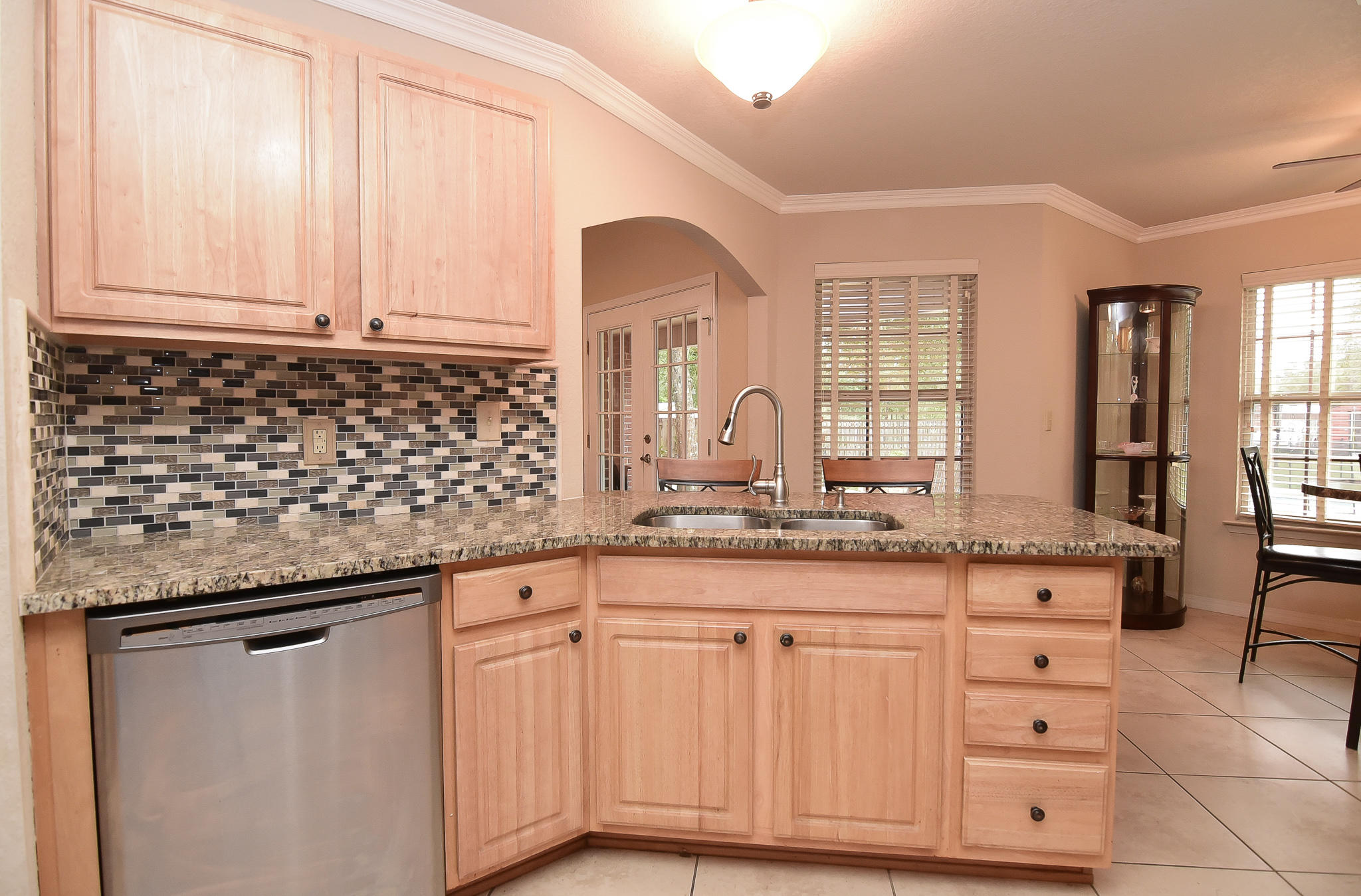 4214 Painter Branch Road Crestview, FL 32539 - Photo 15 of 41 a kitchen with granite countertop a sink and cabinets