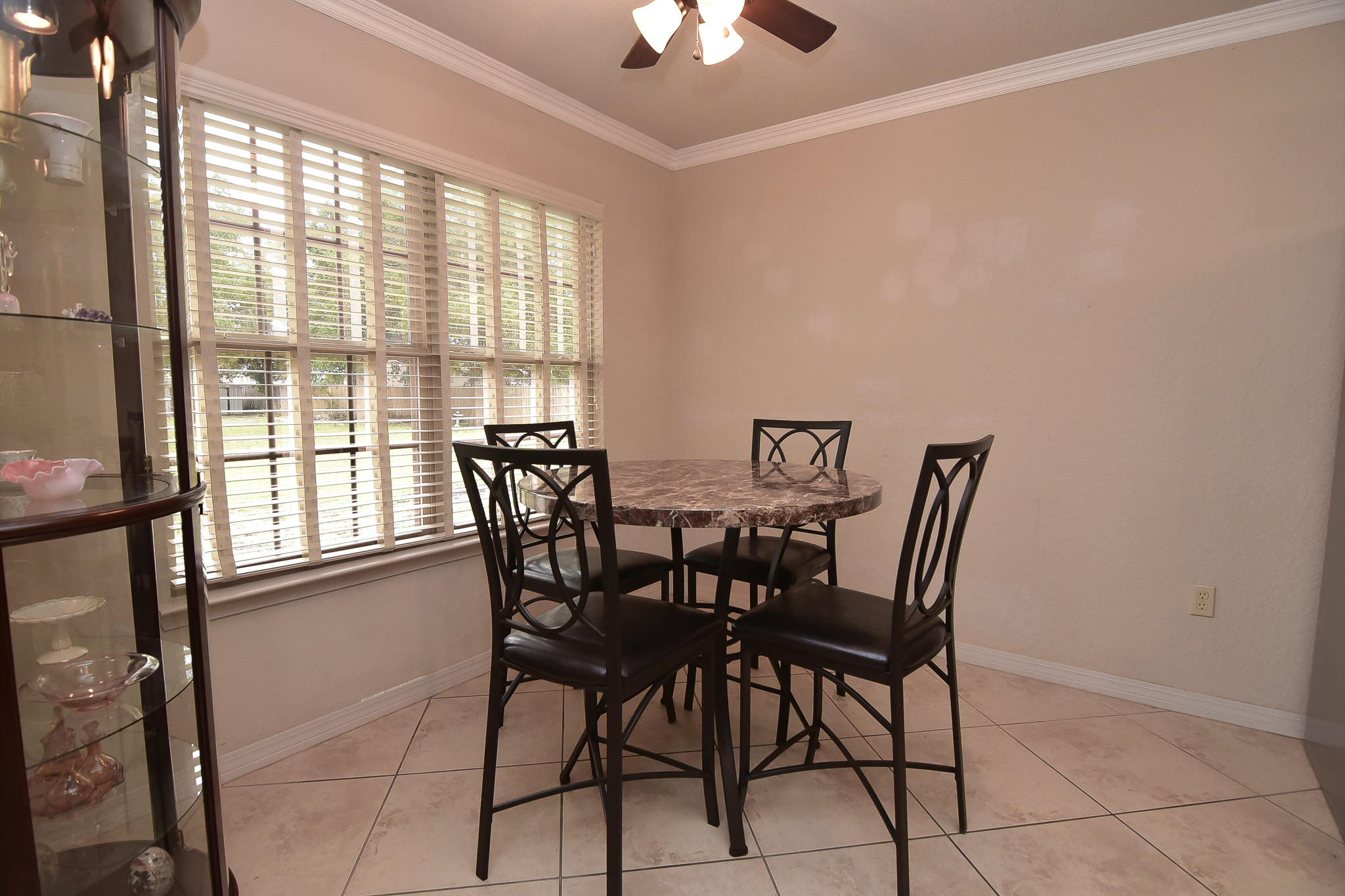 4214 Painter Branch Road Crestview, FL 32539 - Photo 18 of 41 a view of a dining room with furniture and chandelier fan