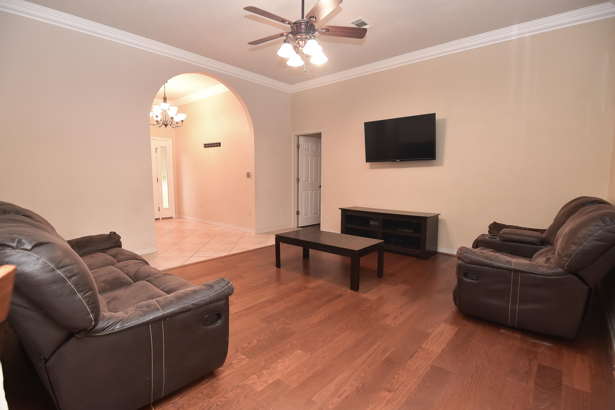 4214 Painter Branch Road Crestview, FL 32539 - Photo 19 of 41 a living room with furniture and a flat screen tv