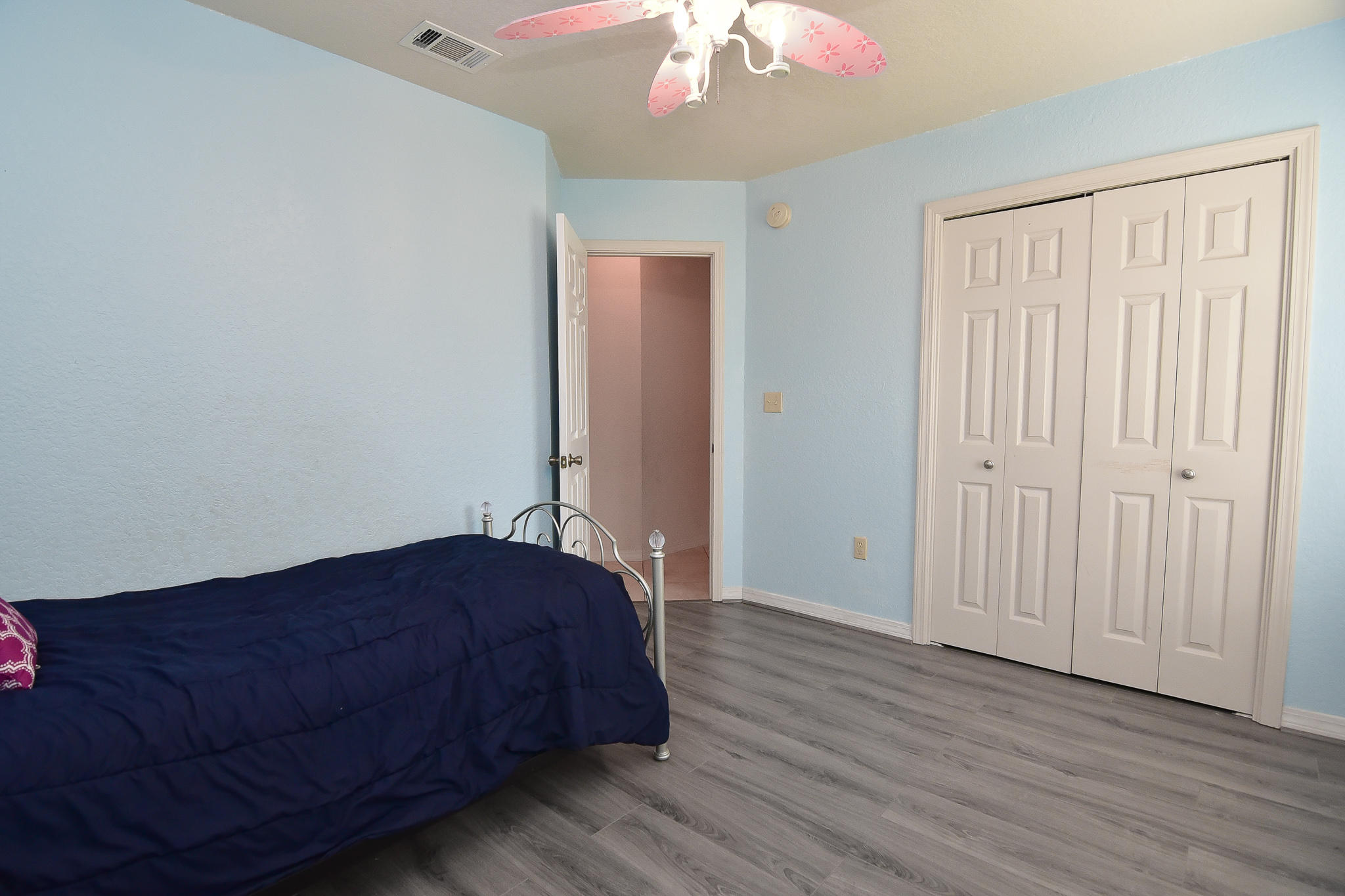4214 Painter Branch Road Crestview, FL 32539 - Photo 23 of 41 a bedroom with a bed and a chandelier fan