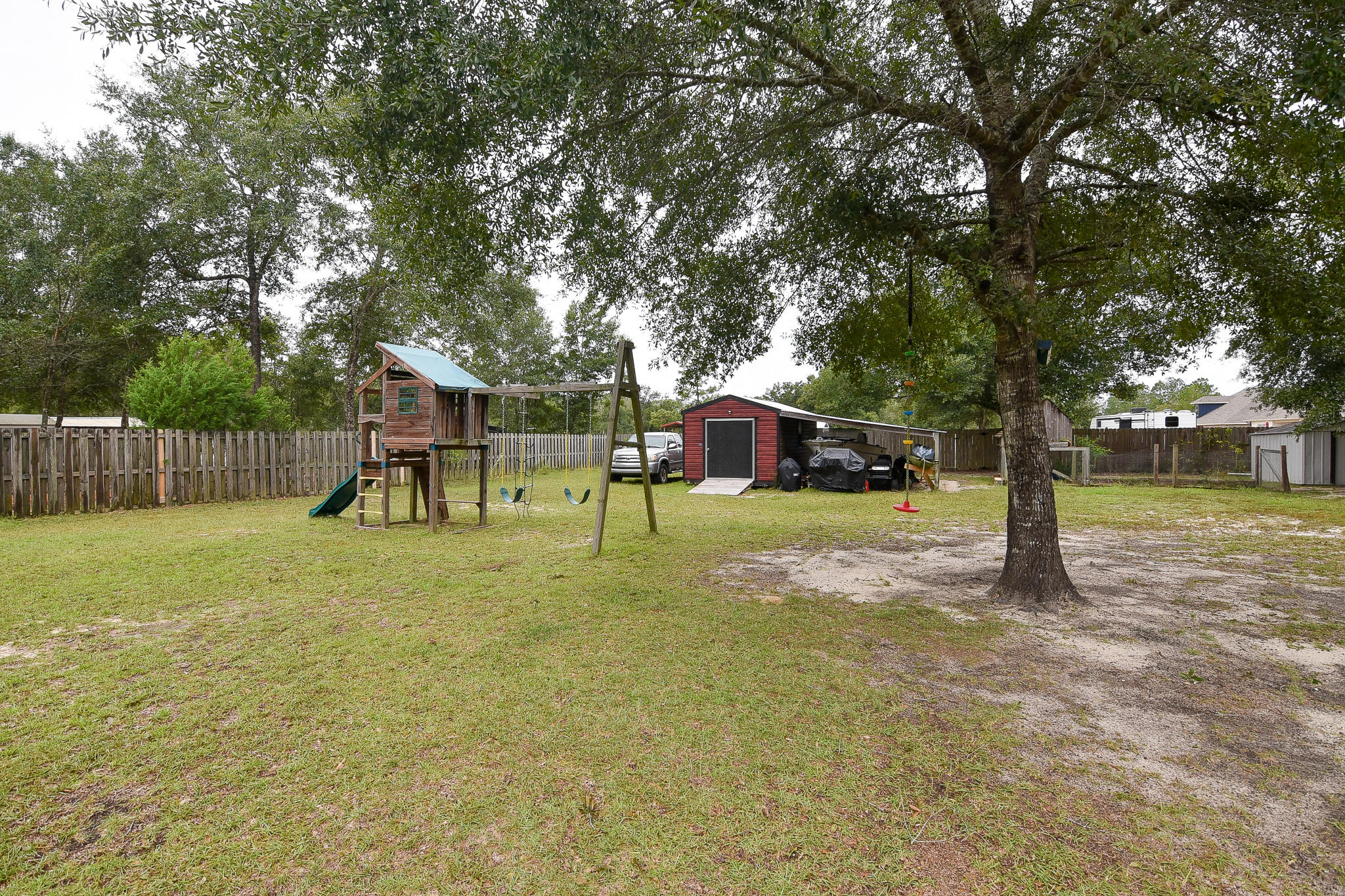 4214 Painter Branch Road Crestview, FL 32539 - Photo 32 of 41 a view of a house with a yard