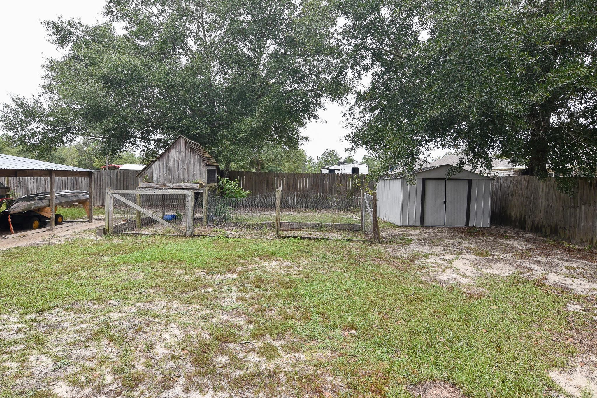 4214 Painter Branch Road Crestview, FL 32539 - Photo 33 of 41 a view of a house with backyard and a tree