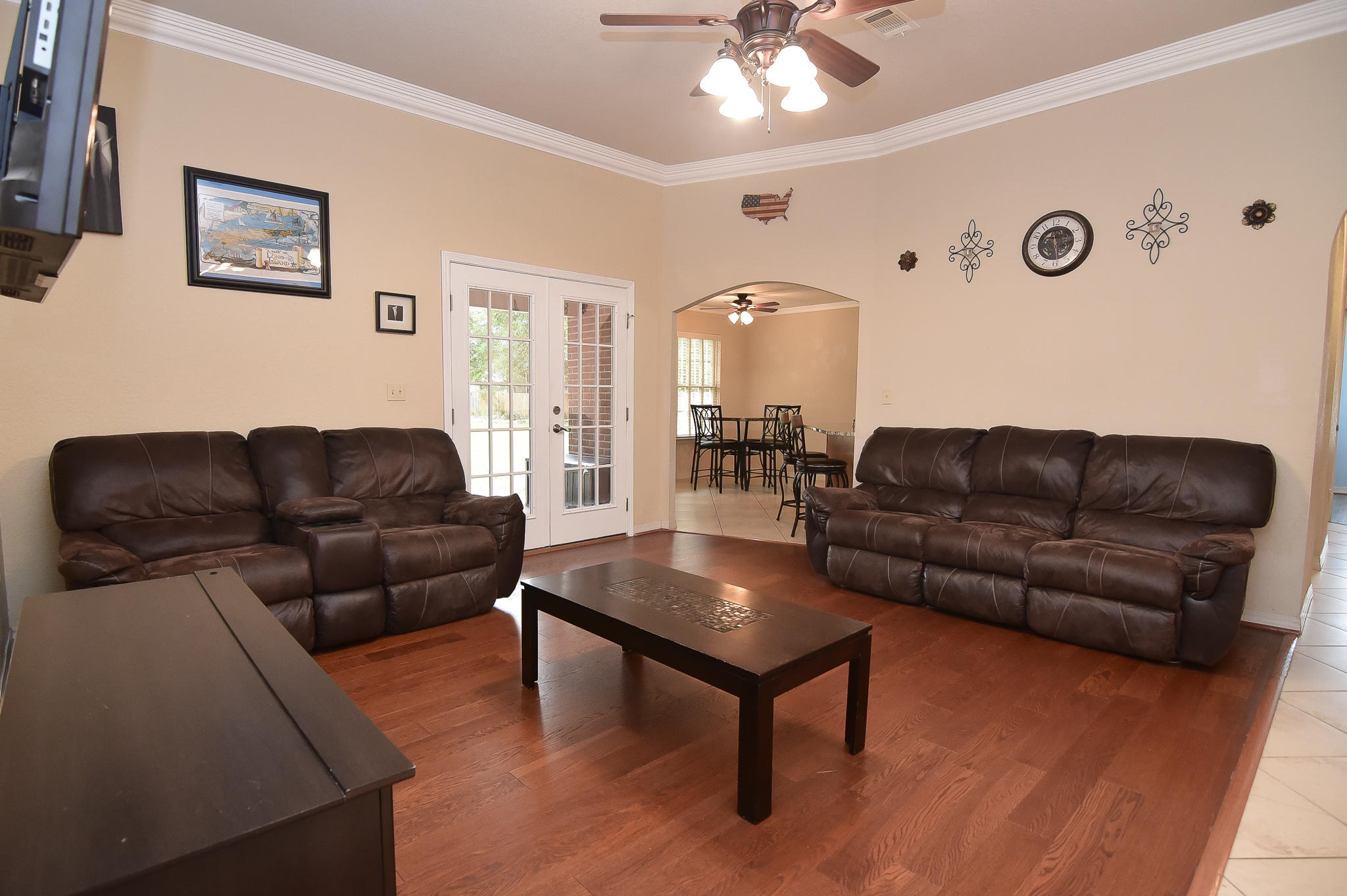 4214 Painter Branch Road Crestview, FL 32539 - Photo 7 of 41 a living room with furniture and a chandelier