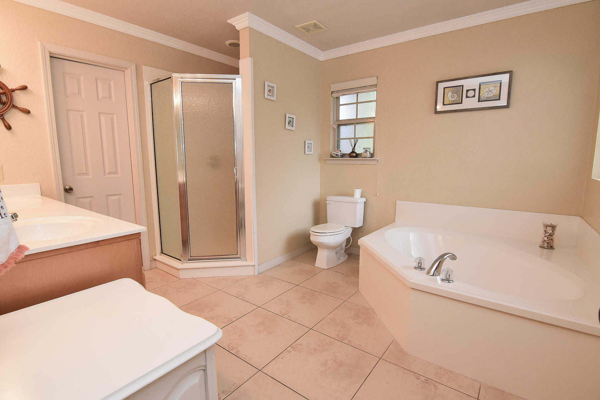 4214 Painter Branch Road Crestview, FL 32539 - Photo 10 of 41 a bathroom with a bathtub and a shower