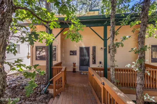 a view of balcony with wooden floor and outdoor seating