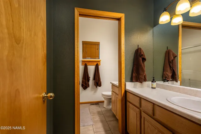 a bathroom with a toilet and a sink