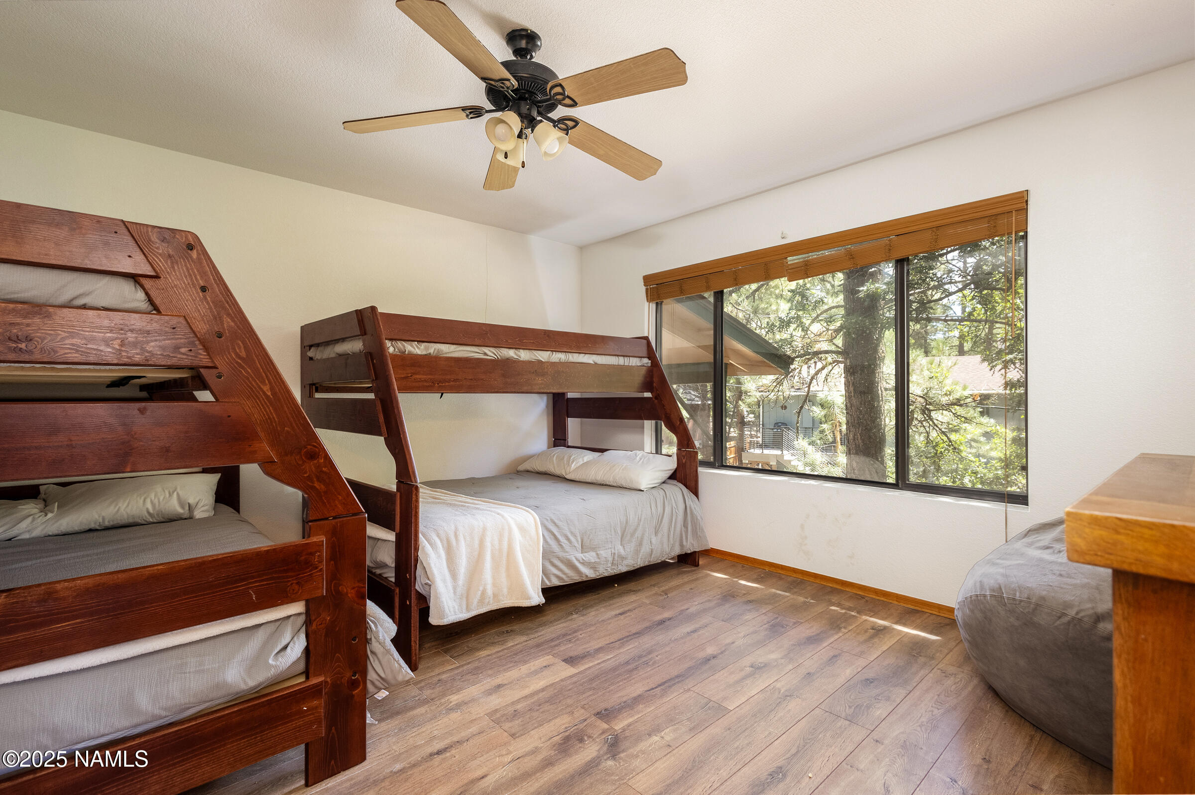 335 Sandia Circle Munds Park, AZ 86017 - Photo 20 of 34 a bedroom with a bed and a window