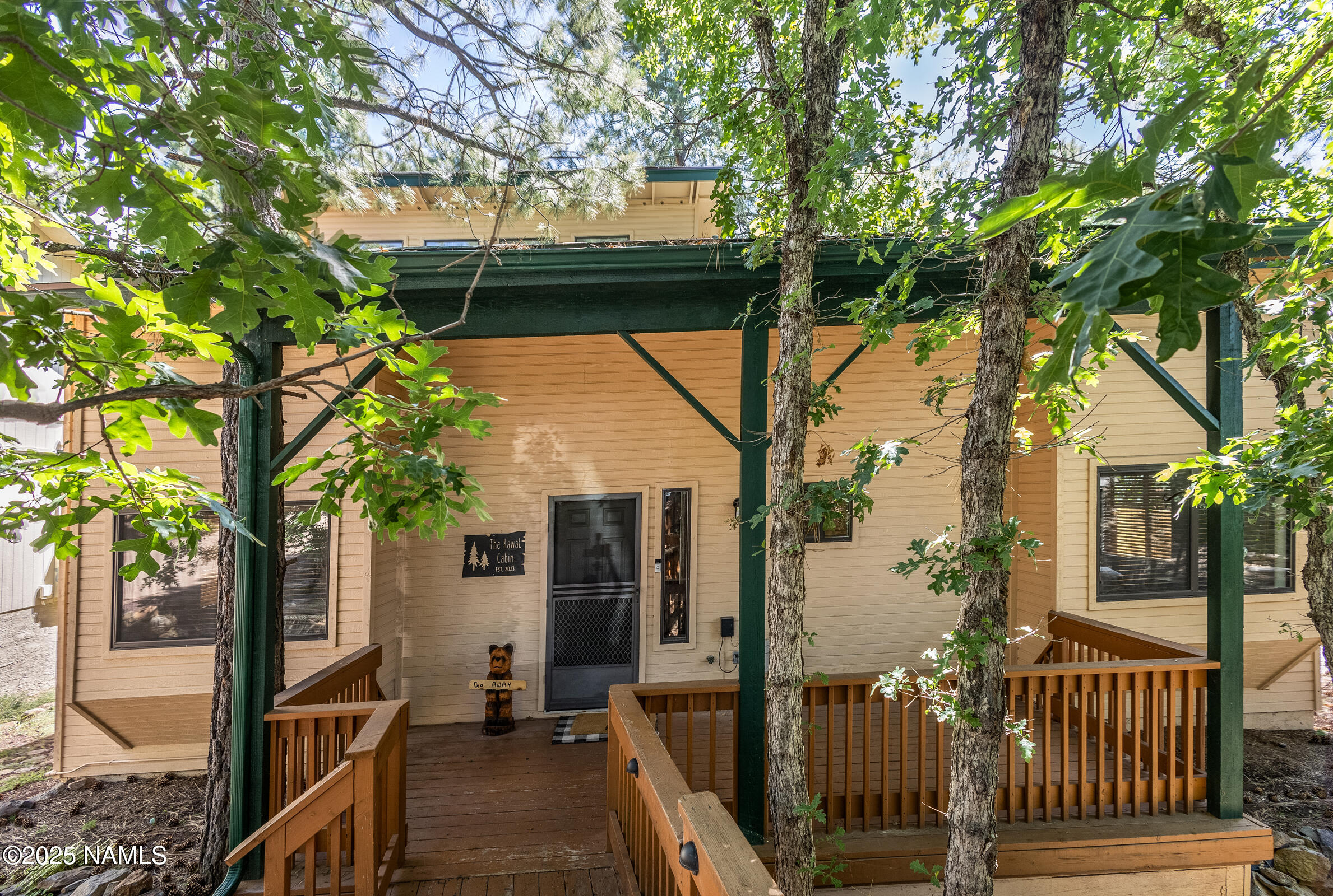 335 Sandia Circle Munds Park, AZ 86017 - Photo 25 of 34 a view of a house with a tree in the background