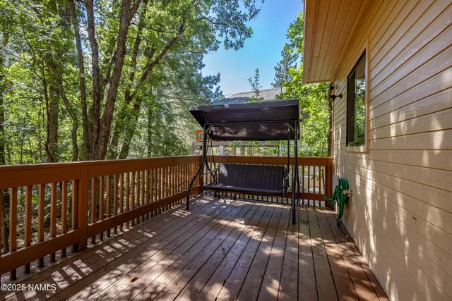 a view of a balcony with chairs and a table