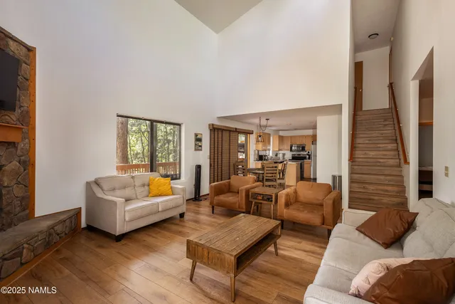 a kitchen with stainless steel appliances a refrigerator and a stove top oven