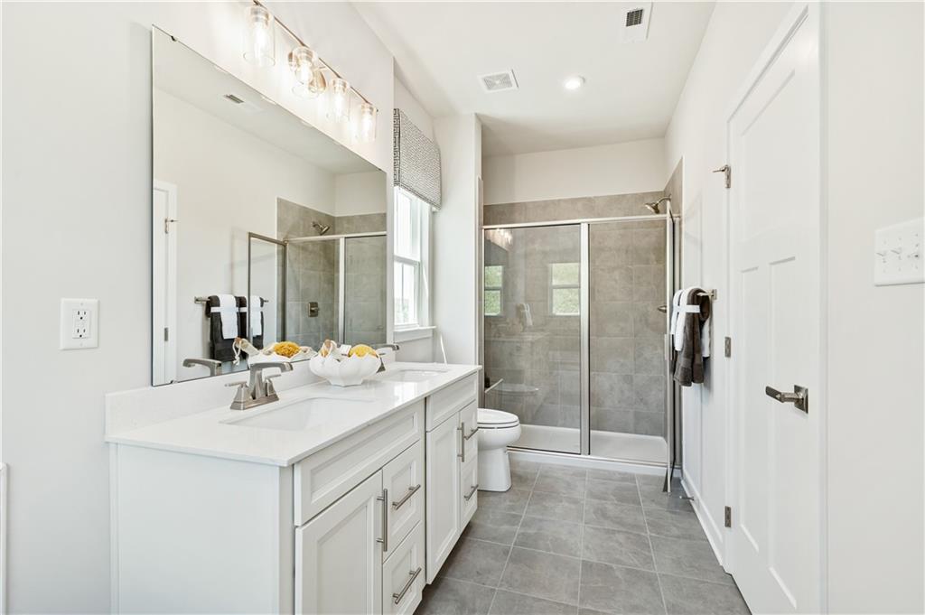 130 Goldenthread Way Coraopolis, PA 15108 - Photo 12 of 27 a bathroom with a sink a toilet and shower