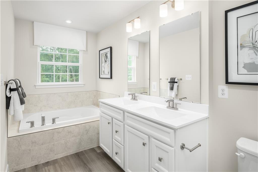 130 Goldenthread Way Coraopolis, PA 15108 - Photo 20 of 27 a bathroom with a tub sink and mirror