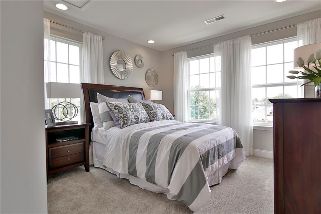 130 Goldenthread Way Coraopolis, PA 15108 - Photo 26 of 27 a bed sitting in a bedroom next to a window