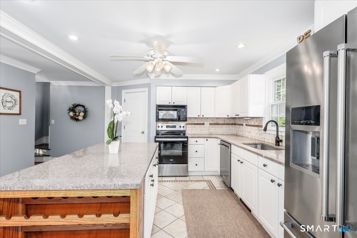 19 Botsford Hill Road Newtown, CT 06470 - Photo 10 of 40 a kitchen with stainless steel appliances granite countertop a stove refrigerator and cabinets