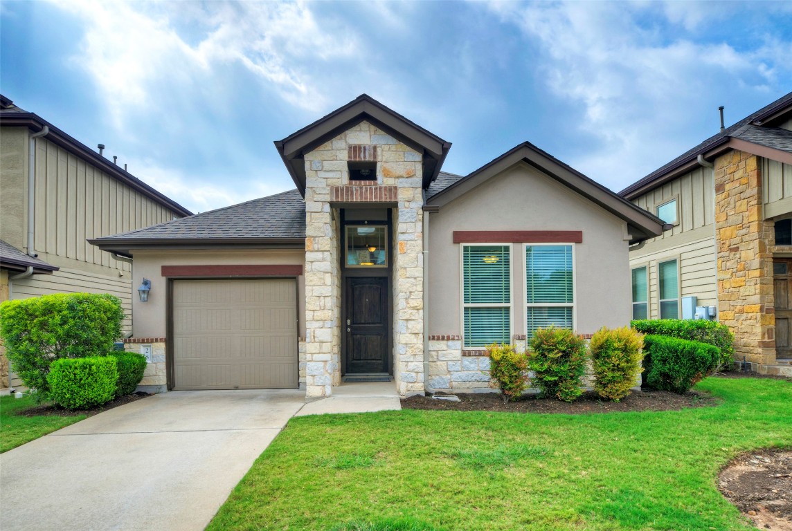 7233 Menchaca Road, Unit 28 Austin, TX 78745 - Photo 1 of 1 a front view of a house with a yard