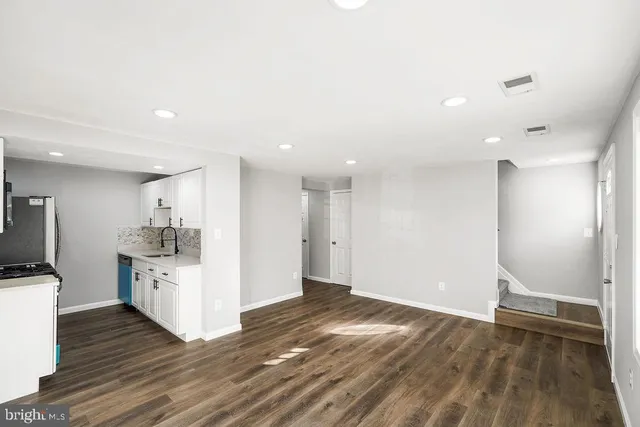 a view of a kitchen with electric appliances