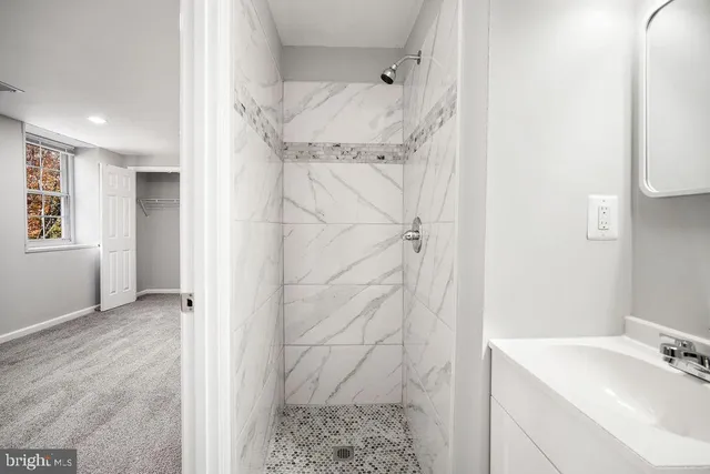 a bathroom with a sink and shower