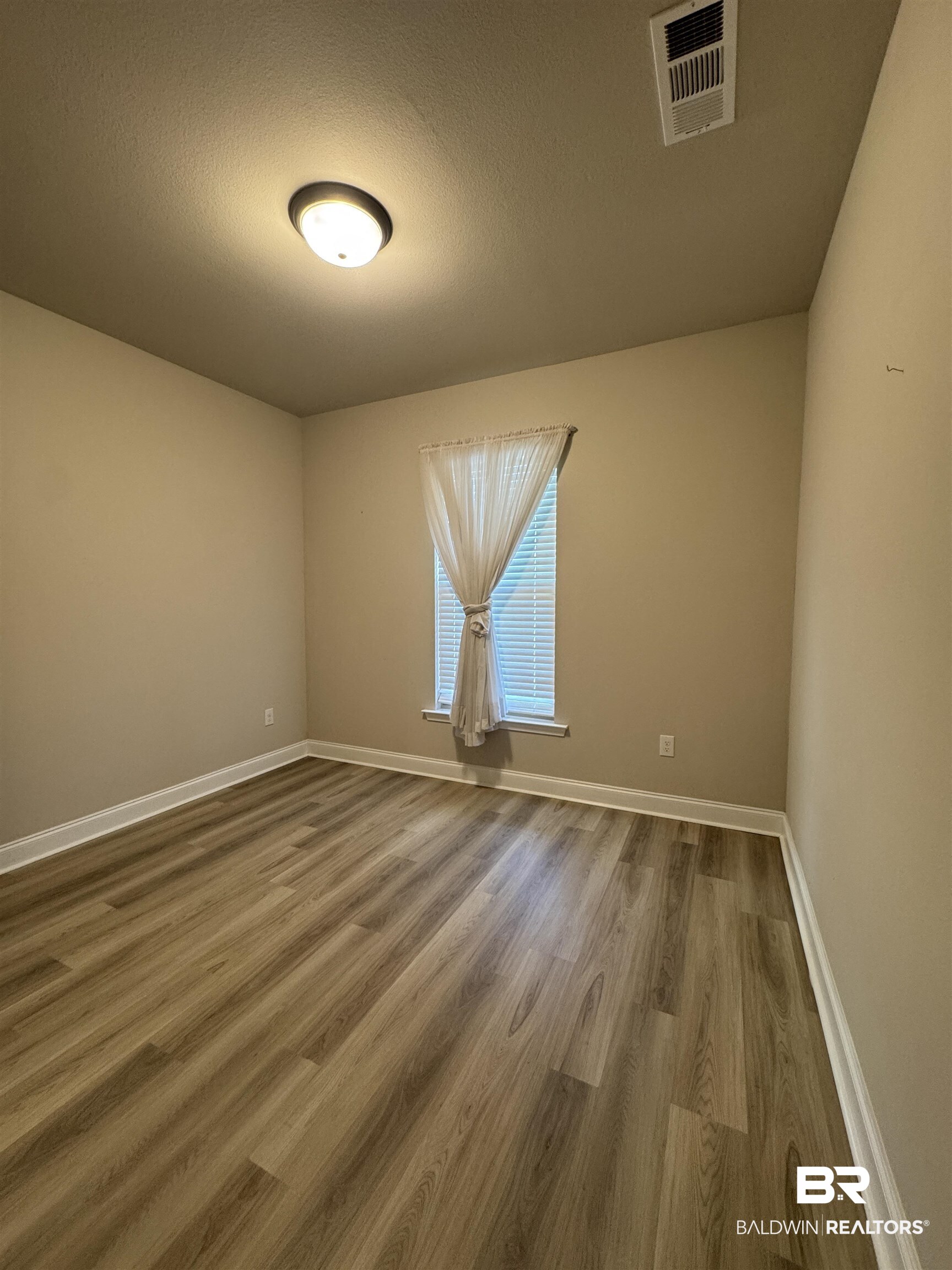 1060 Chloe Street Foley, AL 36535 - Photo 18 of 28 Room featuring neutral wall tones, and white baseboards