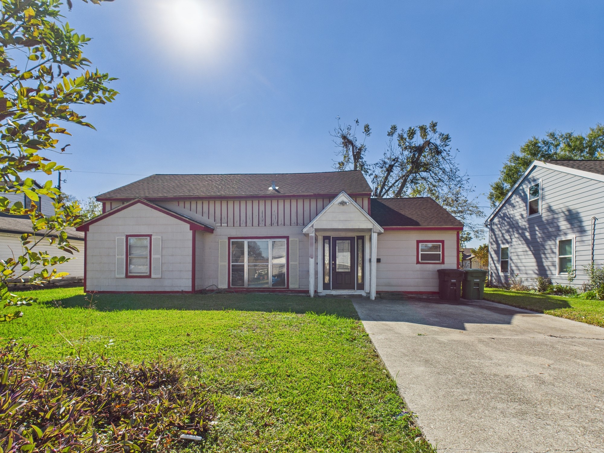 3814 Luca Street Houston, TX 77021 - Photo 1 of 31 a front view of a house with a garden and trees