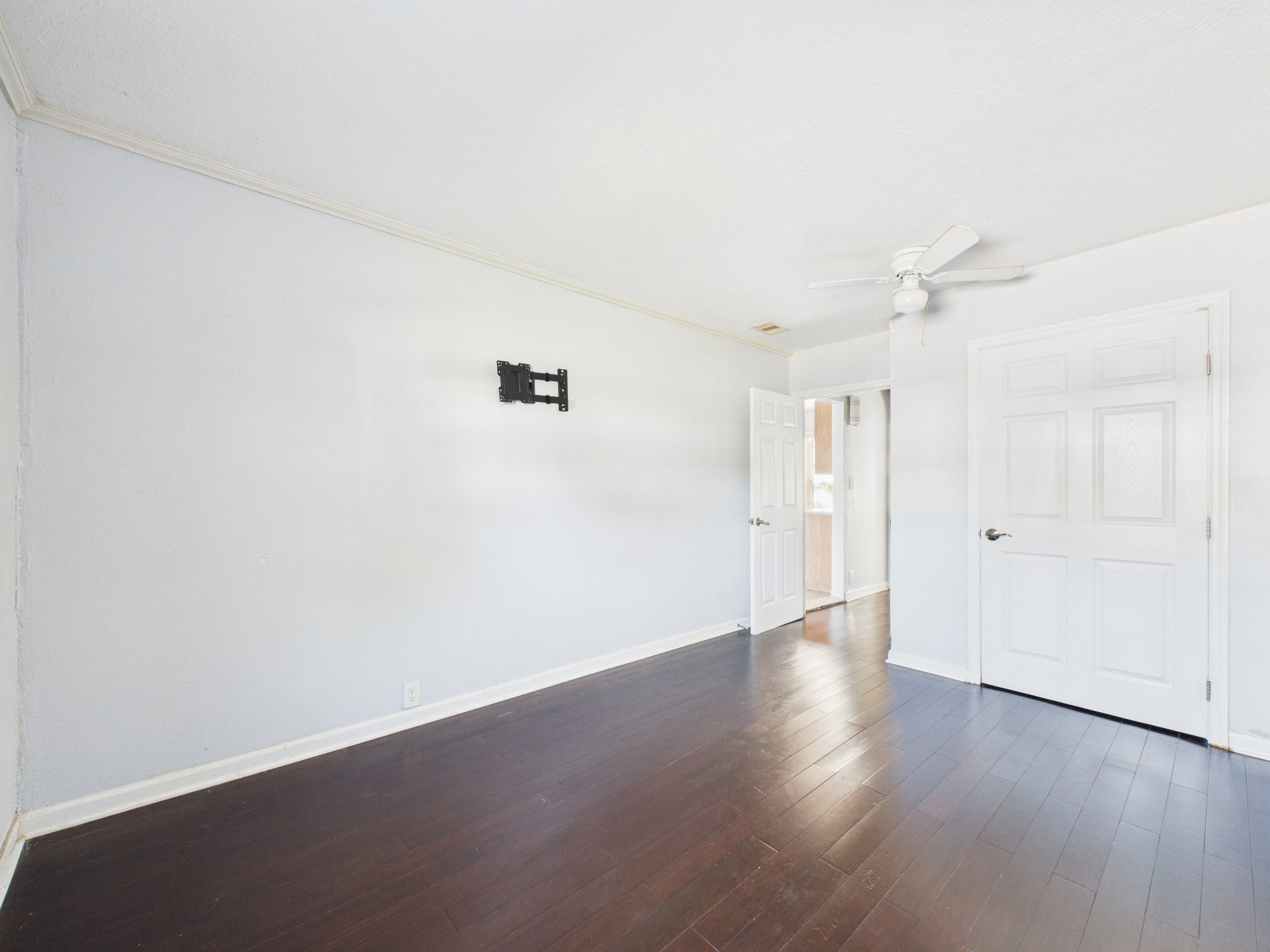 3814 Luca Street Houston, TX 77021 - Photo 12 of 31 an empty room with wooden floor and windows