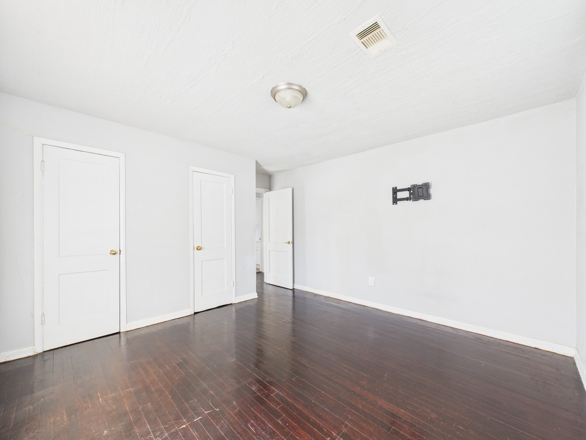3814 Luca Street Houston, TX 77021 - Photo 18 of 31 a view of an empty room with wooden floor