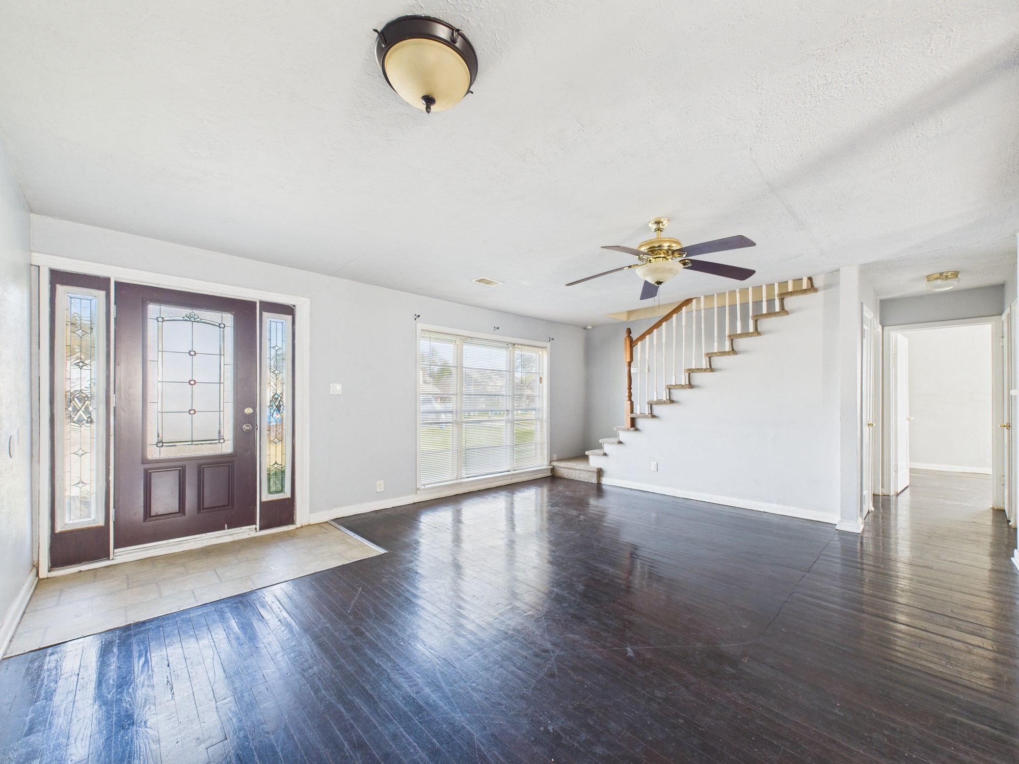 3814 Luca Street Houston, TX 77021 - Photo 2 of 31 a view of an empty room with wooden floor and a window