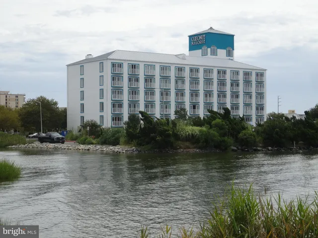 a view of a house with swimming pool and porch