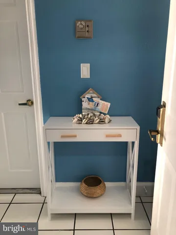 a bed sitting in a bedroom with a lamp
