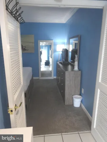 a view of a balcony with table and chairs