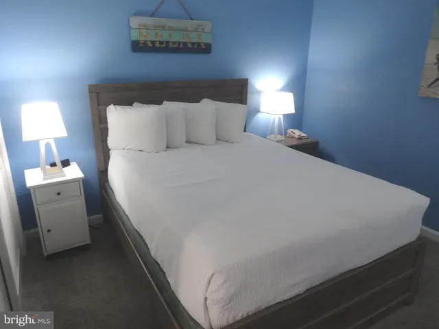 a table with a fireplace and a lamp on table