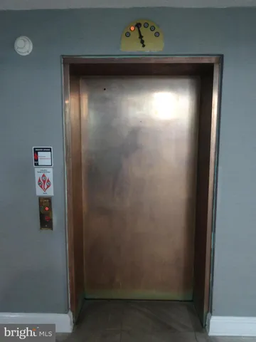 a view of outdoor space with granite countertop a stove and a painting on the wall