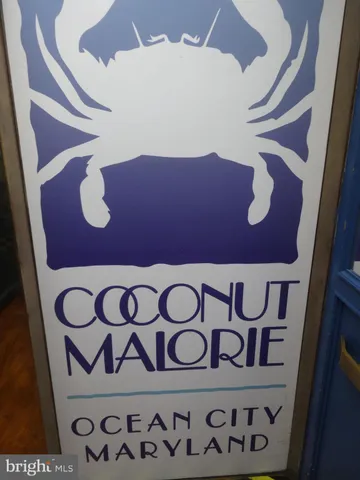 a room with furniture pool table and windows