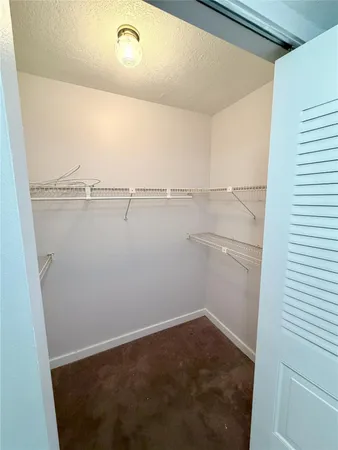 a view of a room with racks on the wall