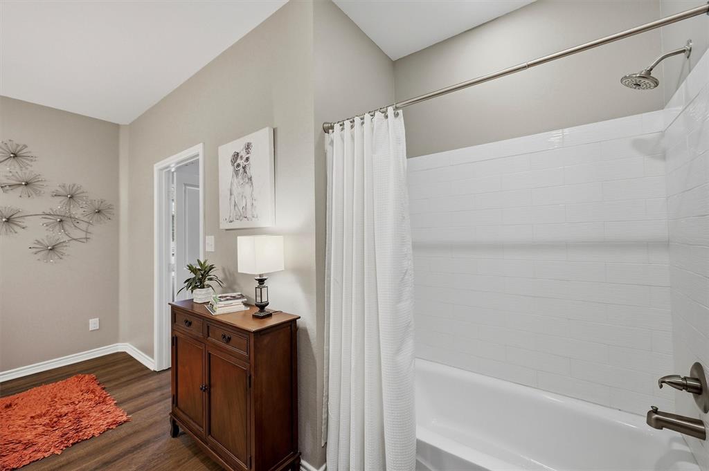 15656 South State Highway 78 Blue Ridge, TX 75424 - Photo 21 of 36 a bathroom with a bathtub and shower