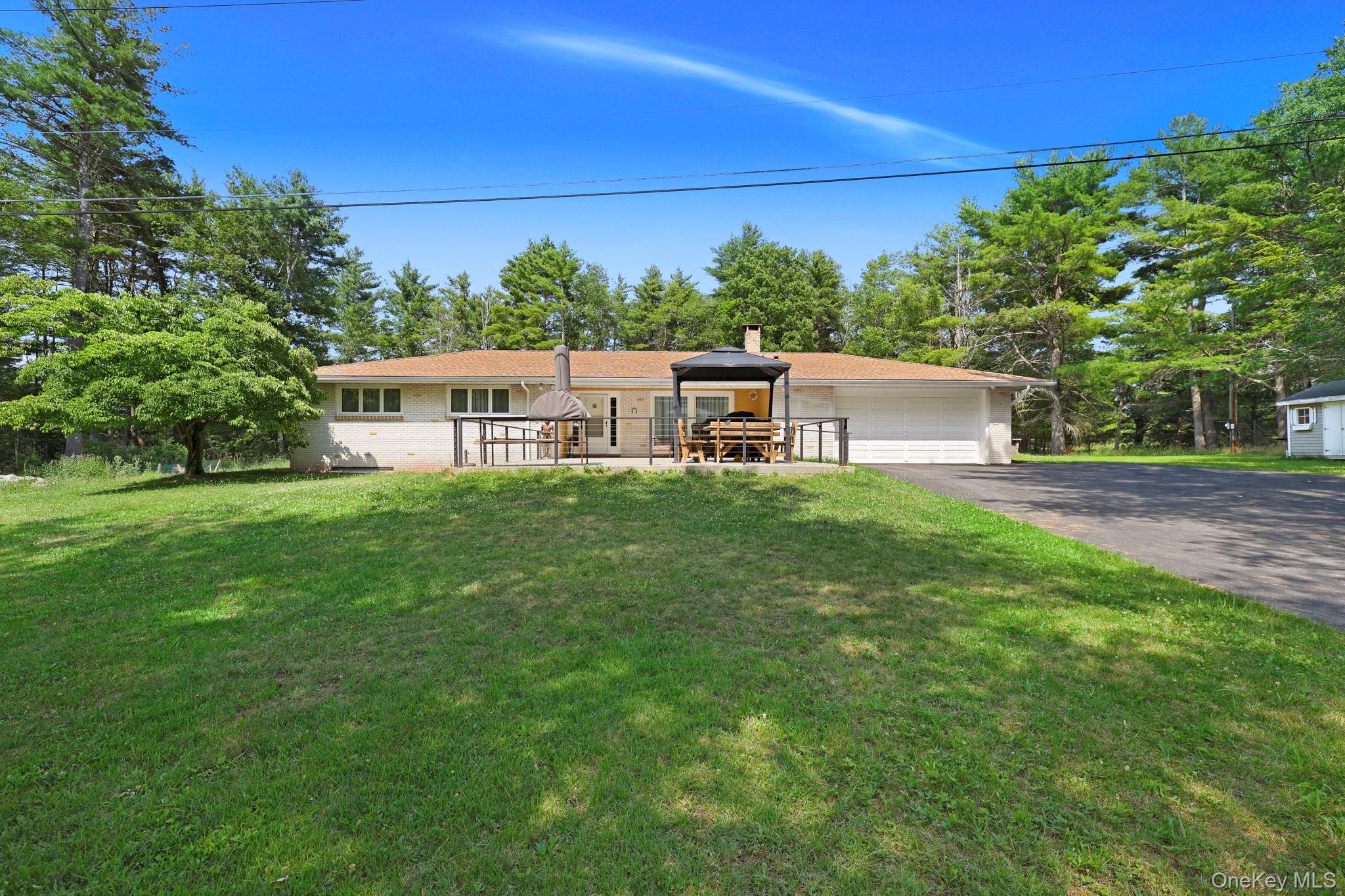 35 Kroeger Road Monticello, NY 12701 - Photo 2 of 29 a view of a white house with a small yard
