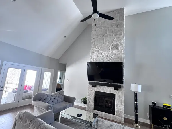 a bedroom with a bed and a ceiling fan