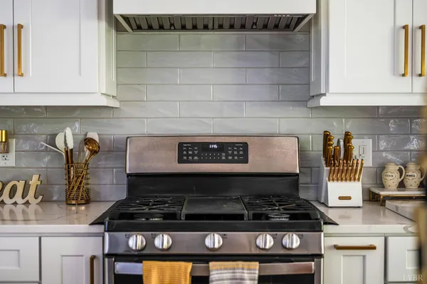 a close view of a stove a microwave and cabinets