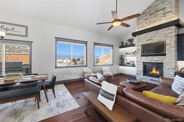 a living room with furniture fireplace and a flat screen tv