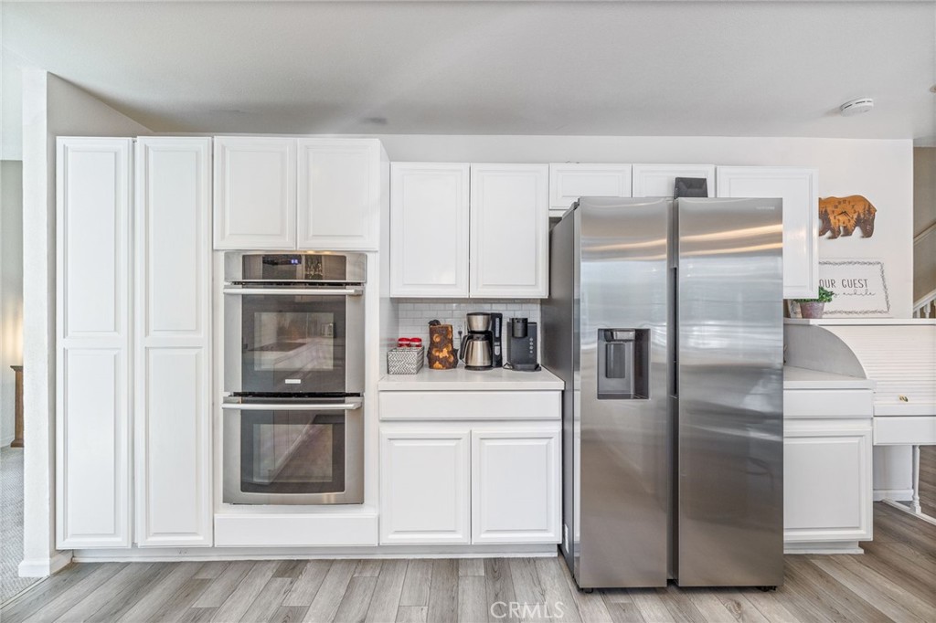 39301 Moonray Lane Oakhurst, CA 93644 - Photo 14 of 55 a kitchen with stainless steel appliances a refrigerator sink and cabinets